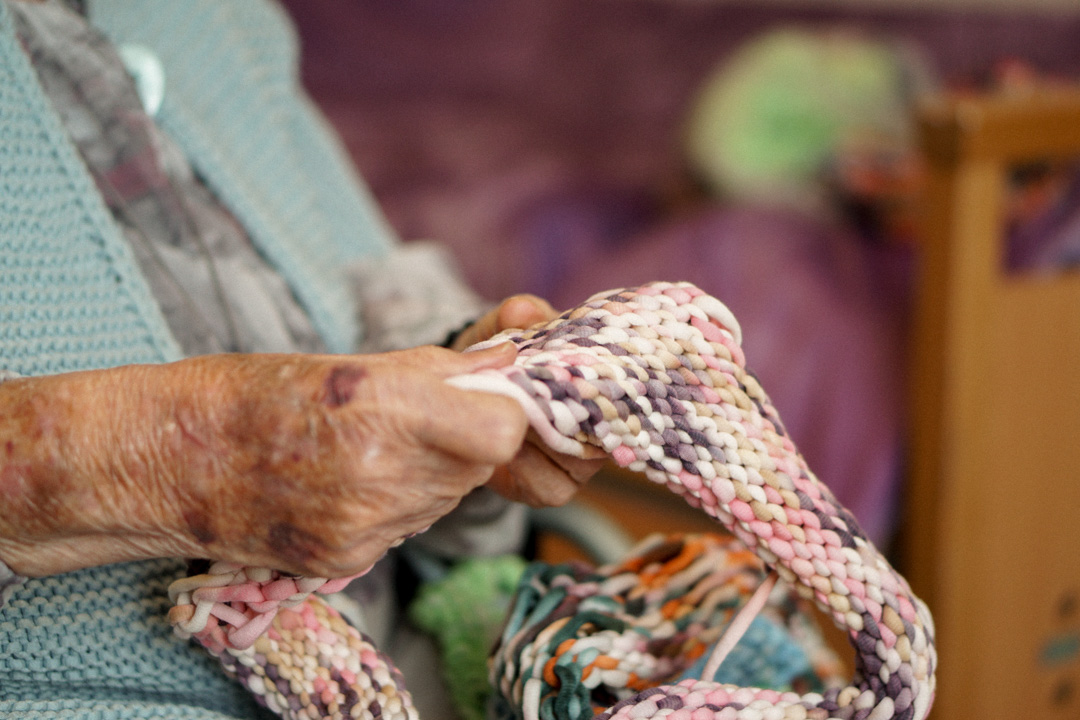 Close-up of Margret's hands while knitting